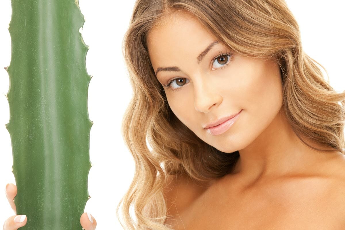 woman with aloe vera plant.
