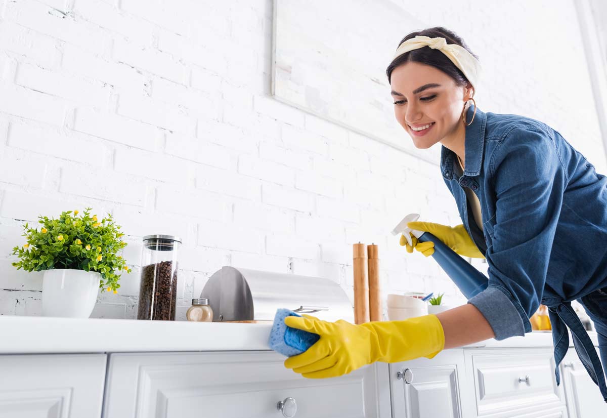 woman cleaning kitchen