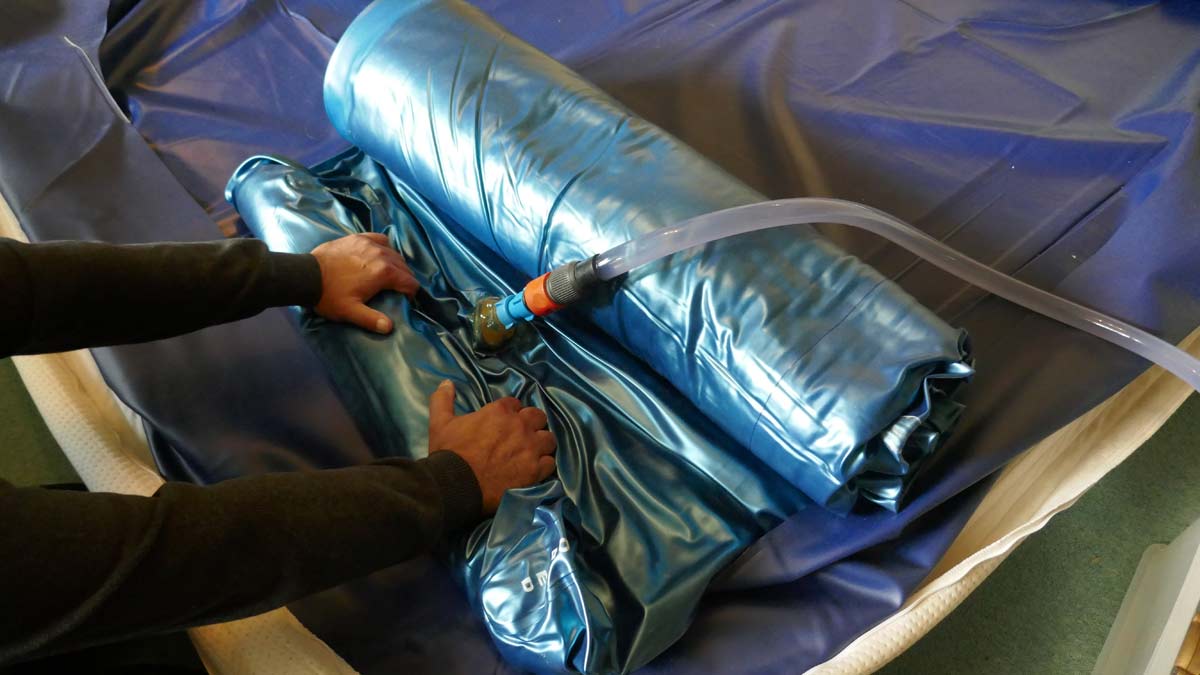 filling up a waterbed mattress.
