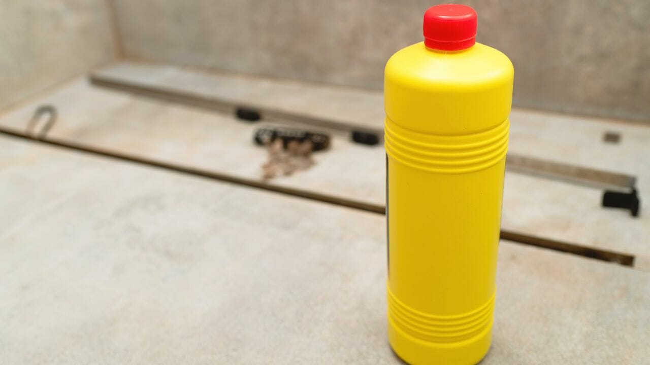 unclogging a shower drain with baking soda and vinegar