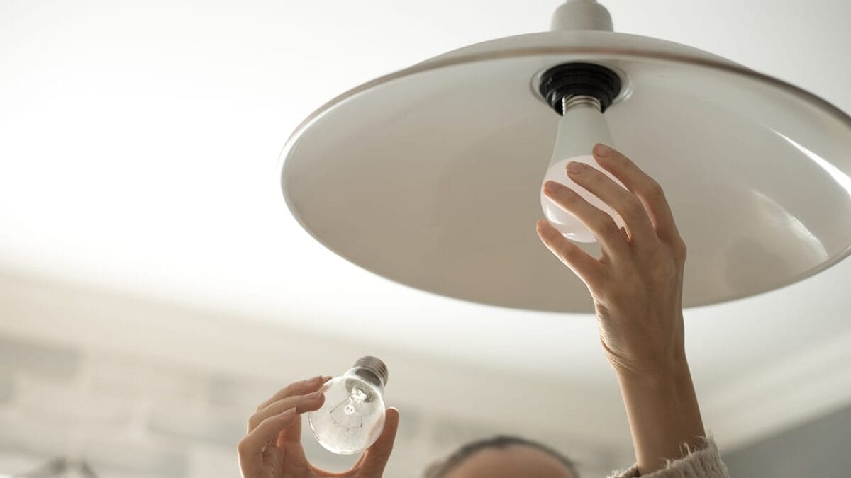 12 Budget-Friendly Home Renovations That Offer the Highest Returns - replacing light bulb ss539802514