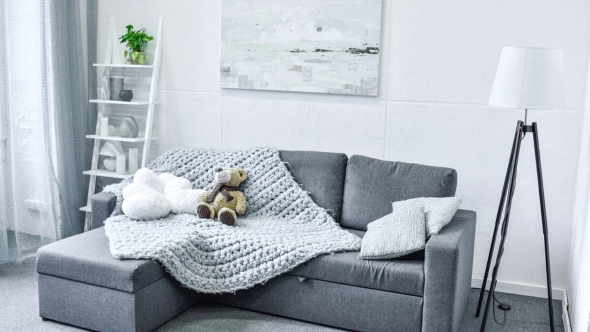 10 Tips for Decluttering if You’re a Messy Person - clean room couch dp163457360