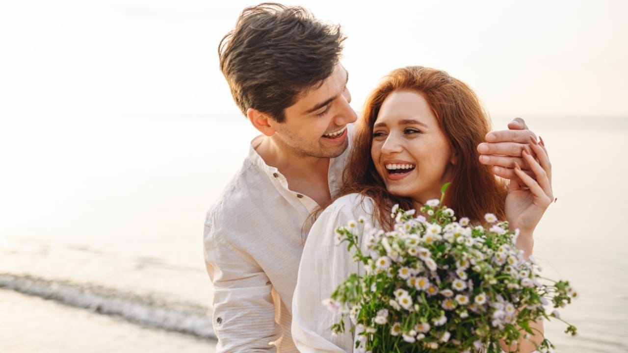 15 Perfect Flowers for Each Anniversary Milestone - couple with flowers ss2053474343