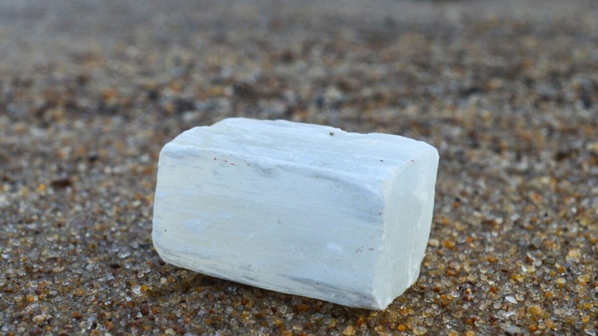 Are You a Magnet for Negativity? Use These 8 Crystals to Help Ward off Bad Vibes - selenite on beach mineral Ss2331238725