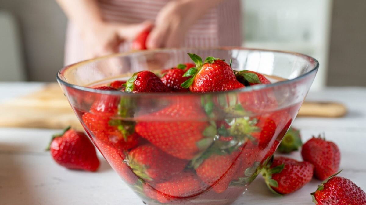 Extend Your Berries’ Shelf Life with This Simple Vinegar Trick - strawberry soak in bowl dp714886302