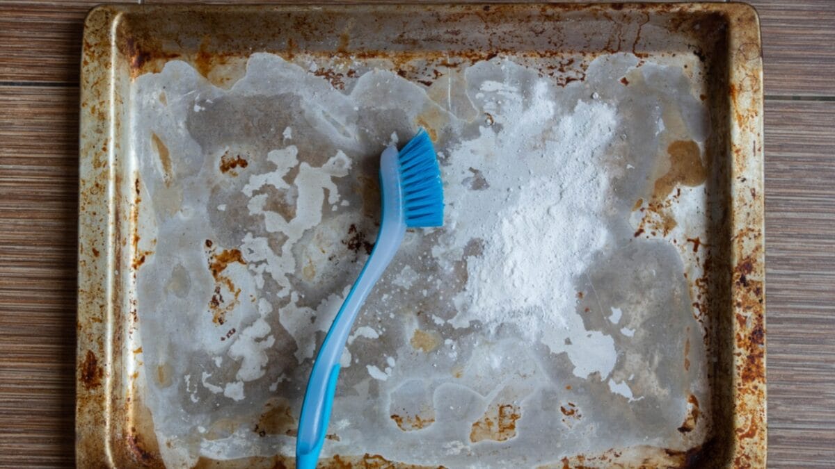 The Secret to Reviving Your Baking Sheets is a Common Medicine Cabinet Staple - dirty aluminum baking sheet ss1676489863