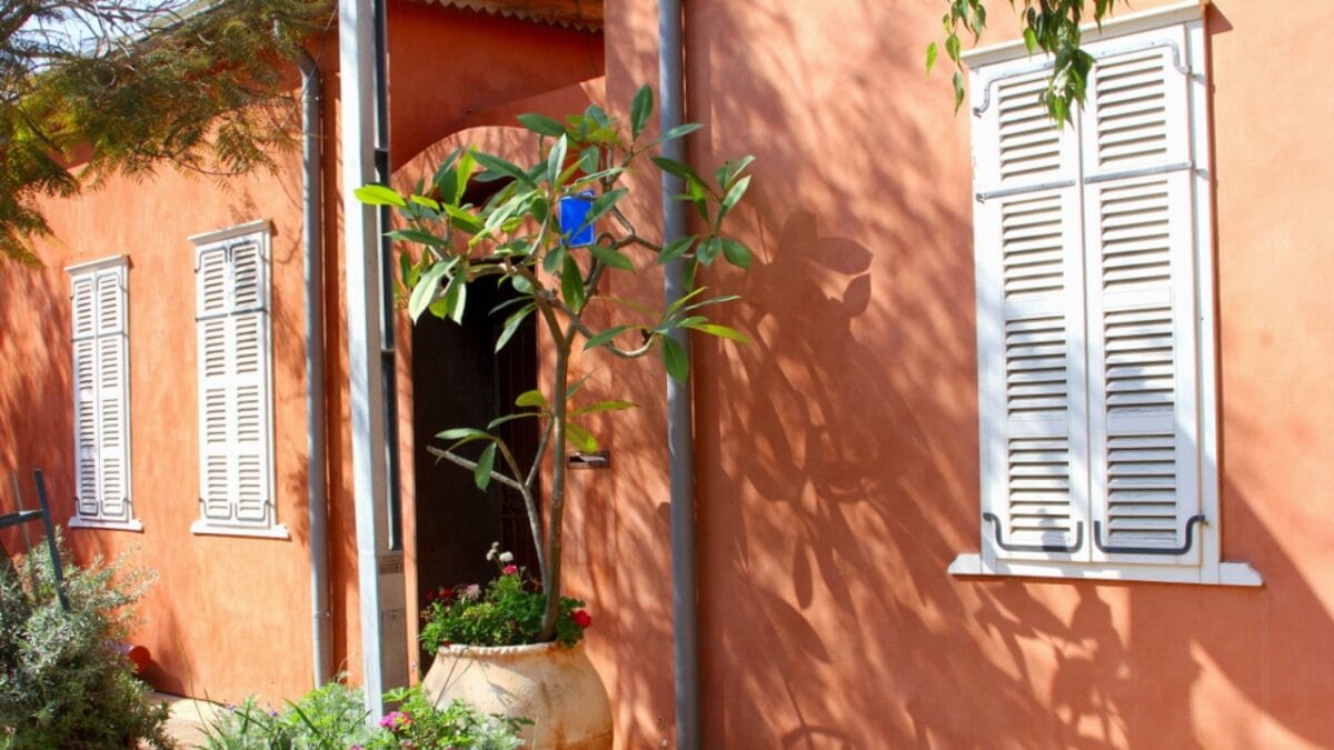 10 Paint Colors That Make Your House Look Dated & What to Use Instead - terra cotta house ss1318185269