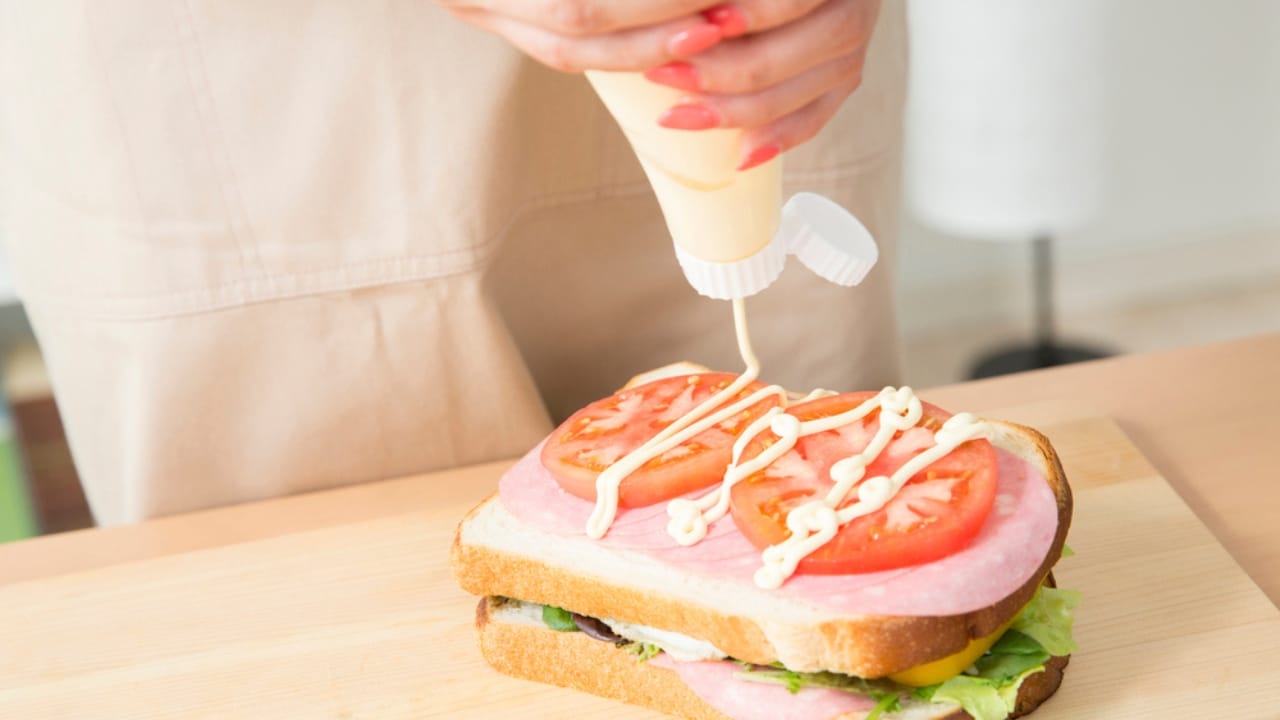 19 Ways to Slash Your Food Costs Without Sacrificing Quality - Making sandwich dp676509268