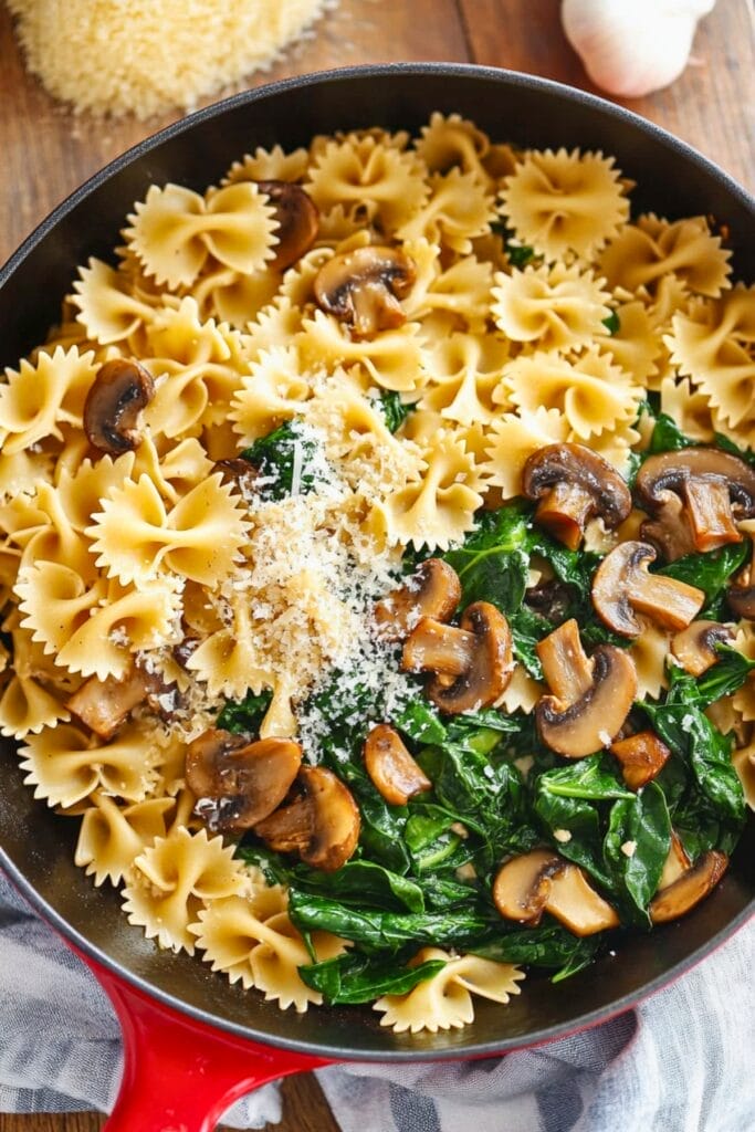 This Parmesan Spinach Mushroom Pasta Skillet Recipe is Savory, Creamy & Ready in Minutes - Parmesan Spinach Mushroom Pasta Skillet recipe