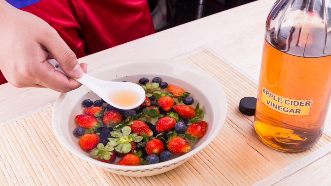 Extend Your Berries’ Shelf Life with This Simple Vinegar Trick - apple cider with strawberry ss742954129