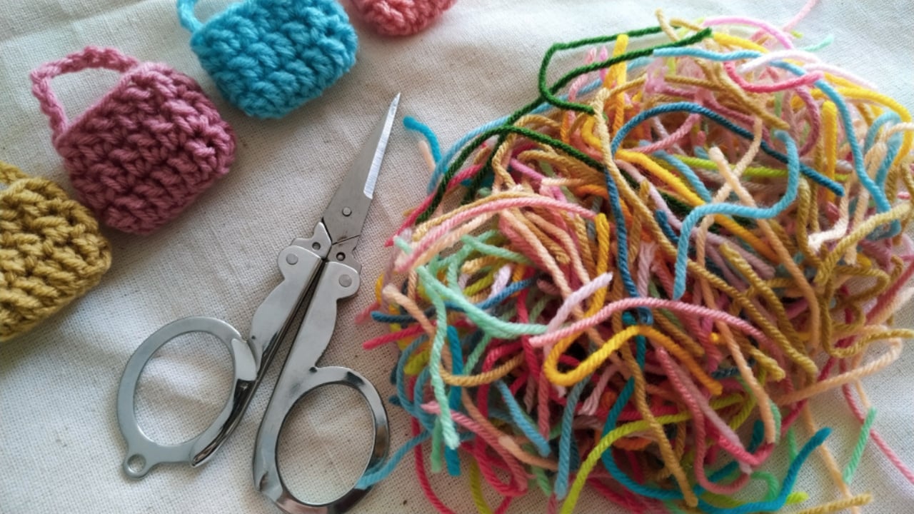Don’t Toss That Yarn: 15 Creative Uses for Your Leftover Scraps - scissors and yarn ss1518415700