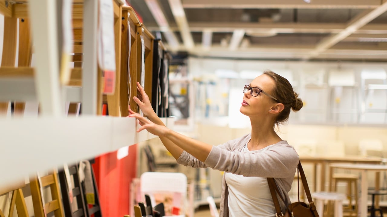 The “10-Year Rule” to Avoid Bad Decor Buys, Designer Says - woman home decor shopping ss395871616 degm