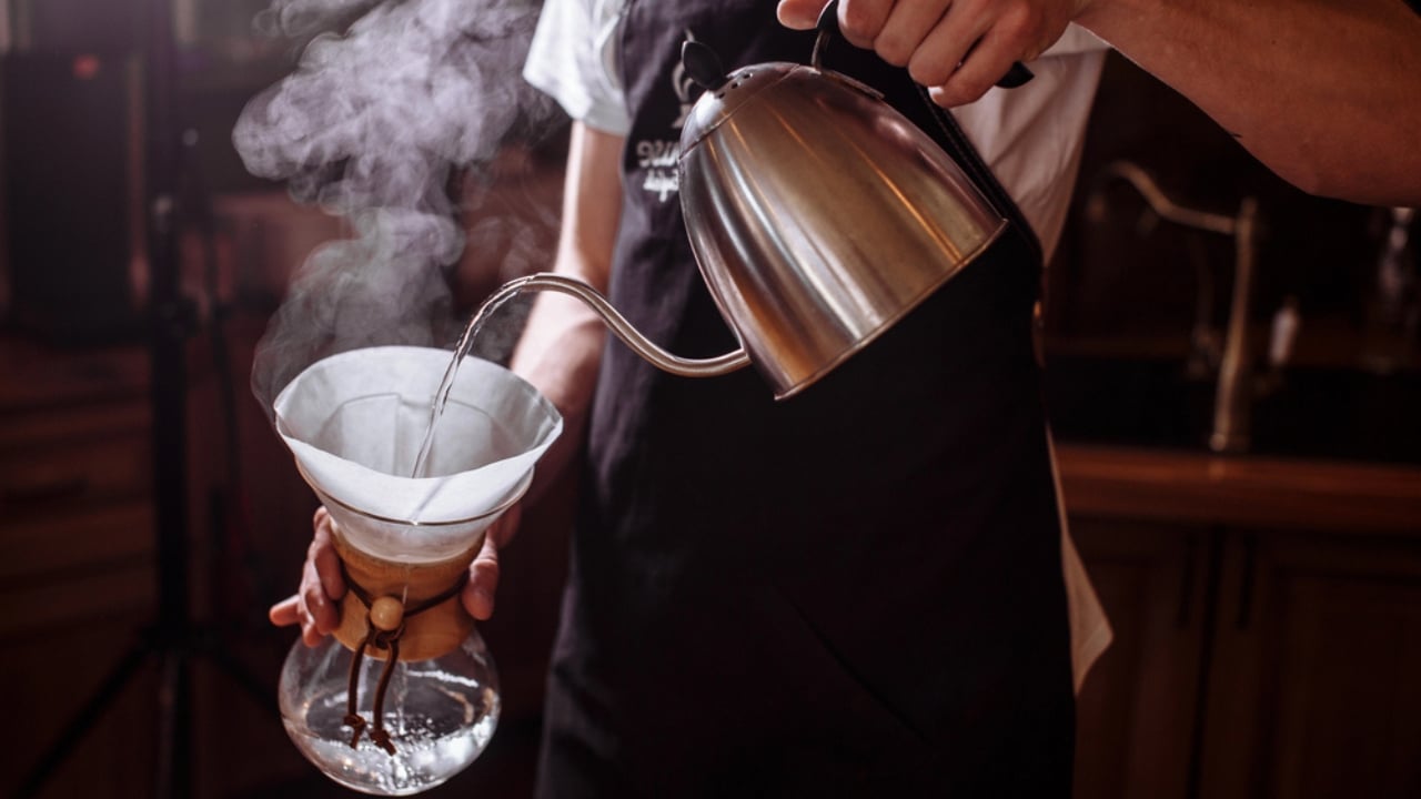 More Than Just for Coffee: 25 Life-Saving Uses for Coffee Filters - woman pouring hot water coffee filter dp207204528
