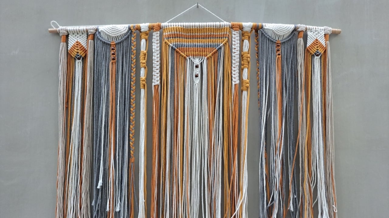 Don’t Toss That Yarn: 15 Creative Uses for Your Leftover Scraps - yarn wall hanging ss2329809969