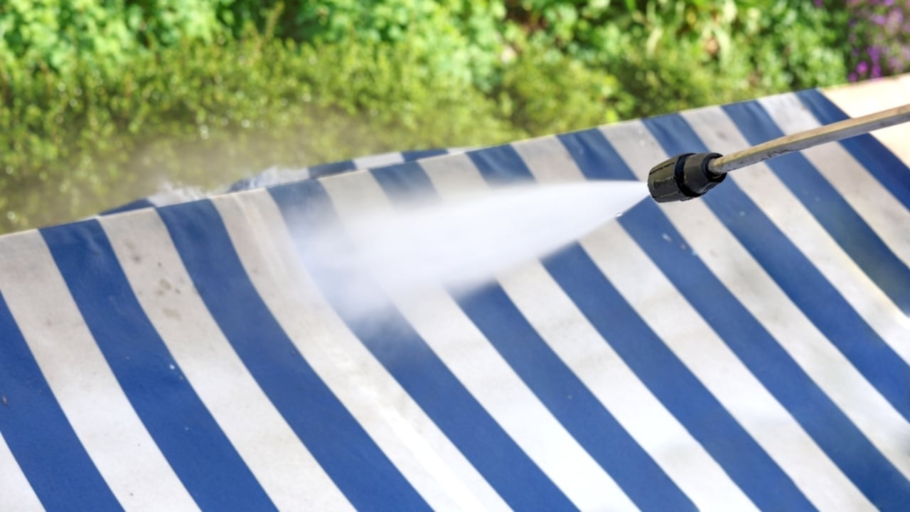 14 Items You Should Never Clean With a Pressure Washer - Cleaning an marquee with high pressure washer ss2455206193 adyh