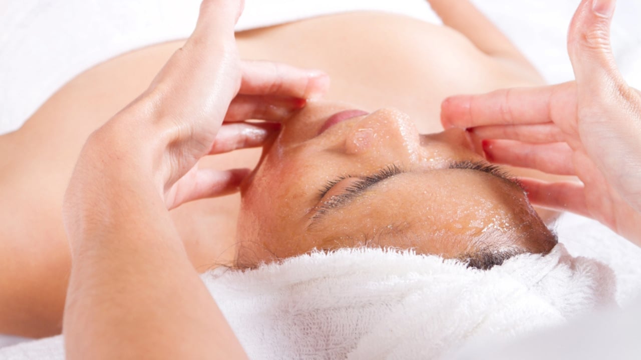 15 Everyday Problems Honey Can Solve Naturally - Woman receiving honey facial massage dp11339959 dnoh