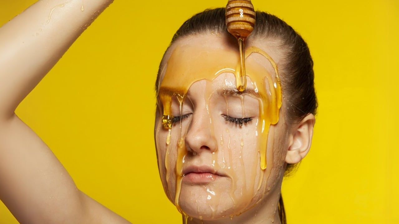 15 Everyday Problems Honey Can Solve Naturally - Woman with honey on her face dp254930804 dnoh