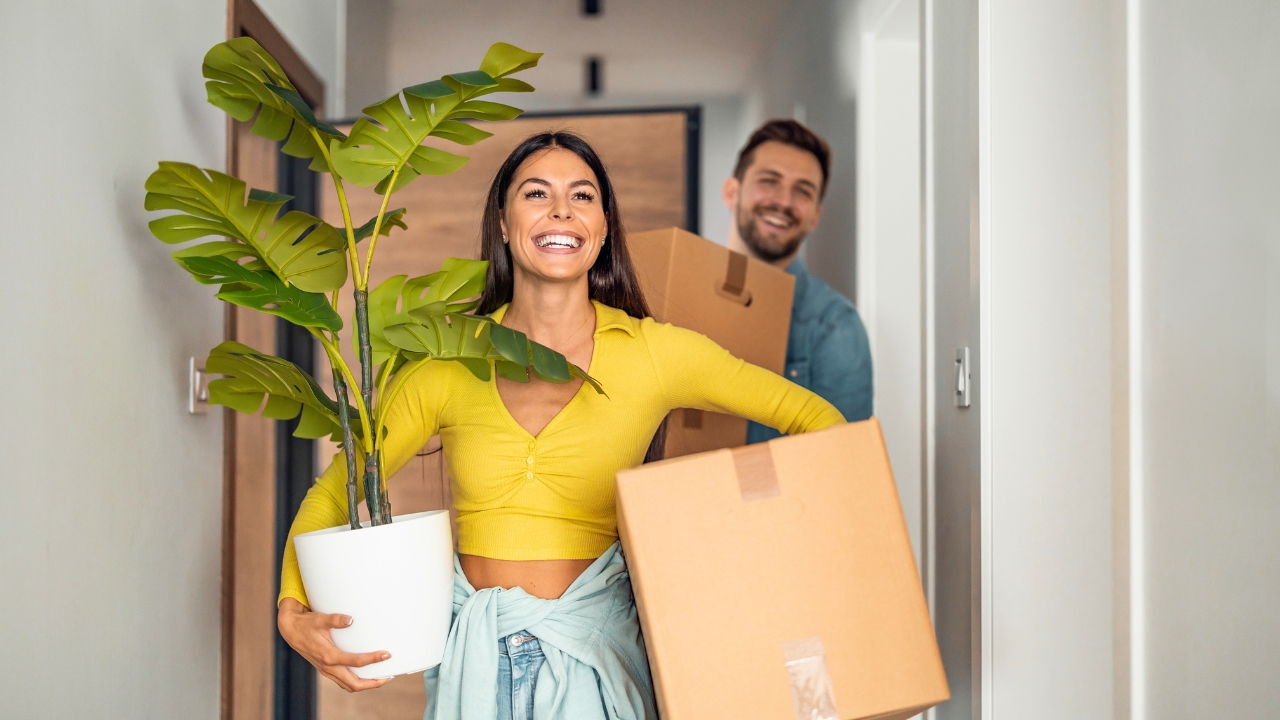 Get Paid to Move: 10 Global Destinations Offering Cash - Young couple moving in new home ss2188934463 degm