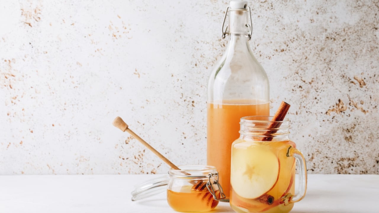 15 Everyday Problems Honey Can Solve Naturally - healthy drink with apple cider vinegar honey ss1312154456 dpdgm