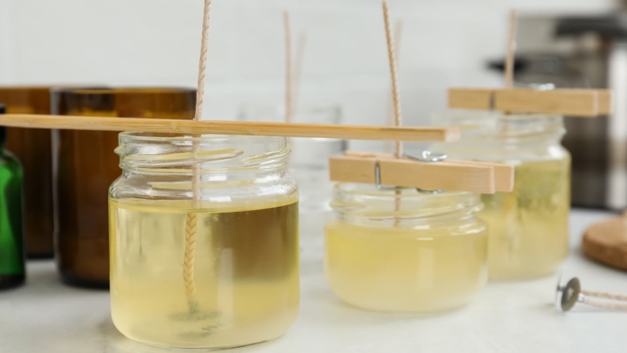 Say Goodbye to Mosquitoes with These DIY Mason Jar Candles - making candles in a jar dp518529826 dnoh