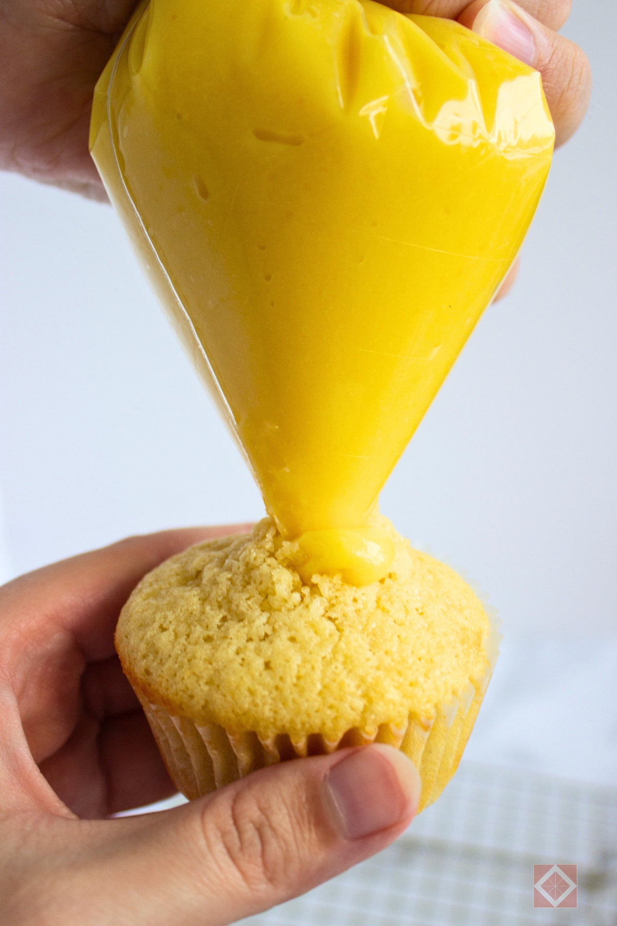 Lemon-Filled Easter Cupcakes With Creamy Frosting - vanilla frosted cupcakes 3