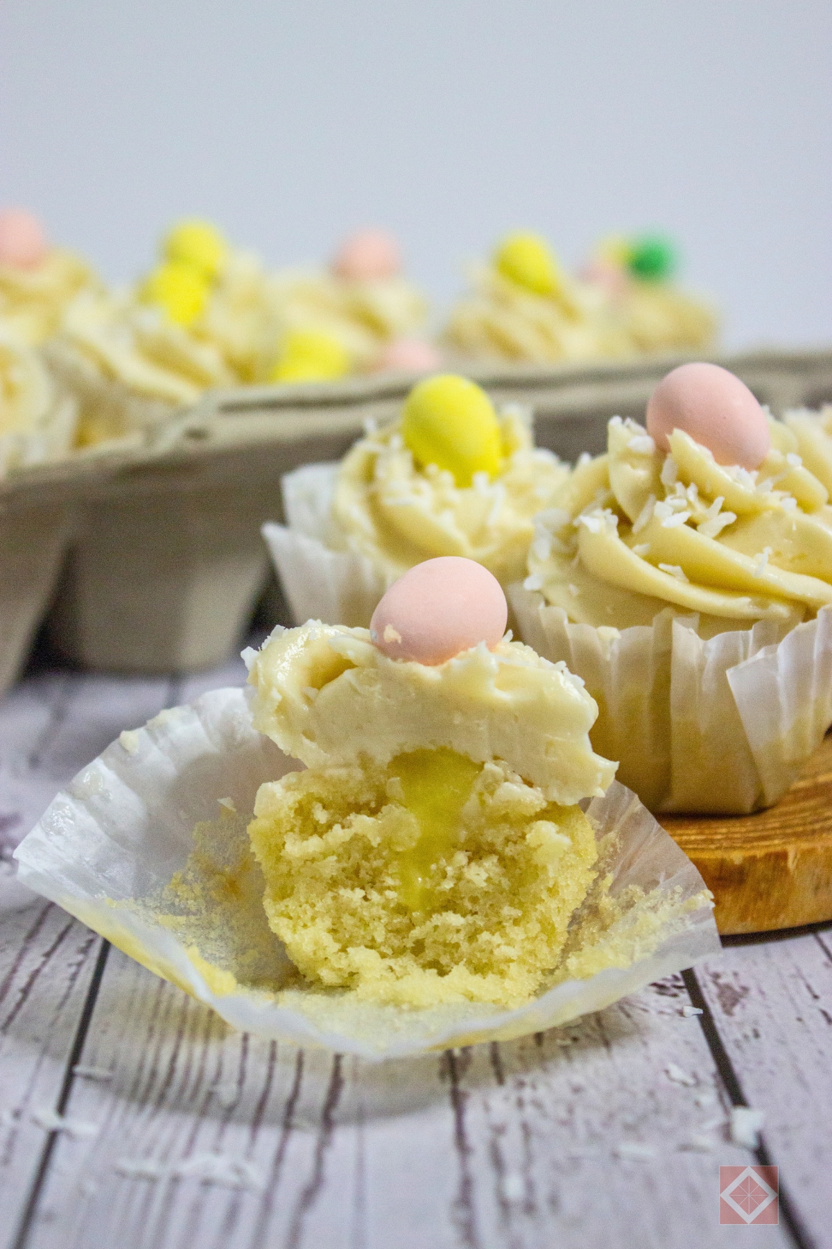 Lemon-Filled Easter Cupcakes With Creamy Frosting - vanilla frosted cupcakes 5
