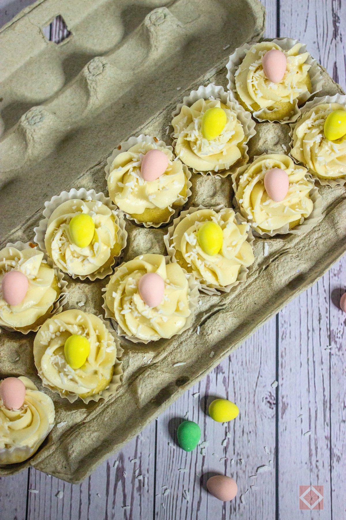 Lemon-Filled Easter Cupcakes With Creamy Frosting - vanilla frosted cupcakes