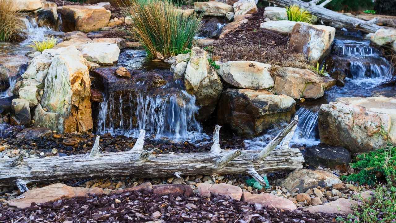 17 River Rock Landscaping Ideas That Turn Simple Yards Into Showpieces - river rock landscaping ideas ss1053533489 dnoh